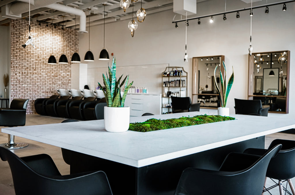 Inside Capelli Salon Studio in Saskatoon Canada. Image showing table and salon chairs